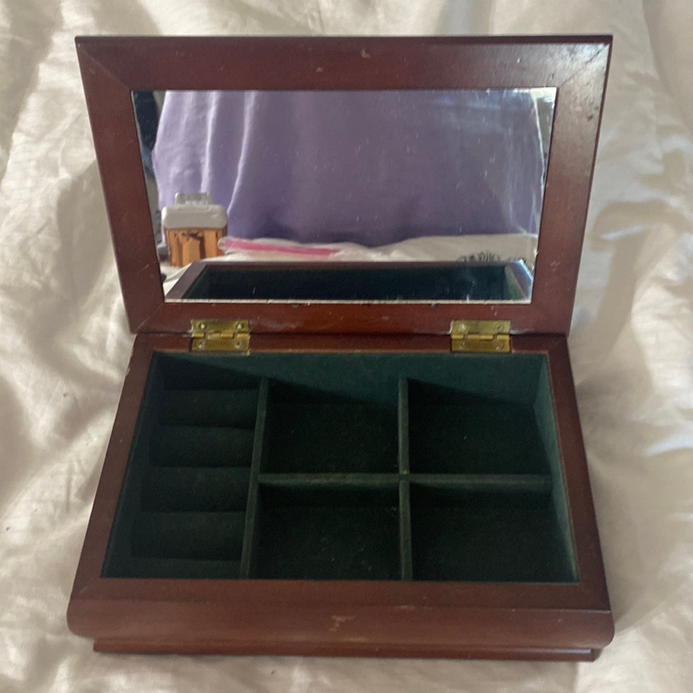 SOLD!!!!!!!!!!!!!!!!!!Jewelry box with mirror and spaces for jewelry cubbyholes.